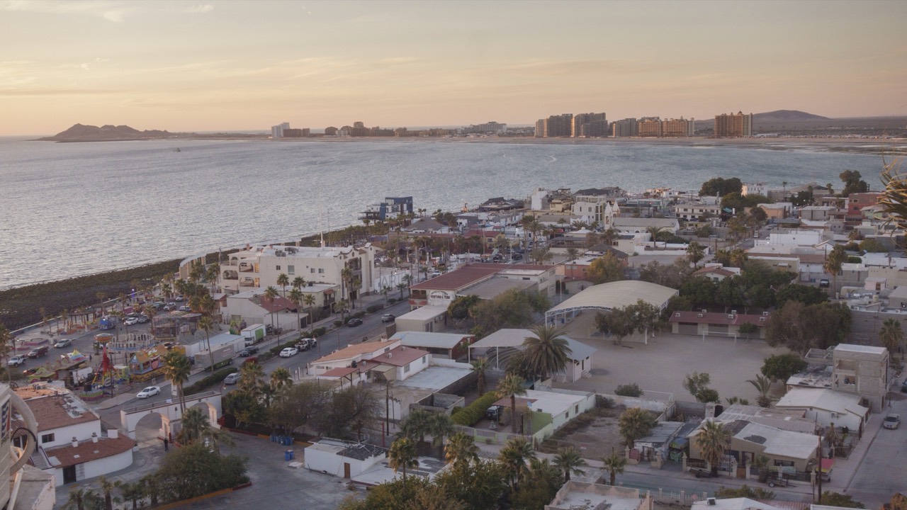 Sunset view from Cerro de la Ballena over the Malecón, the bay, Sandy Beach high-rises and La Choya